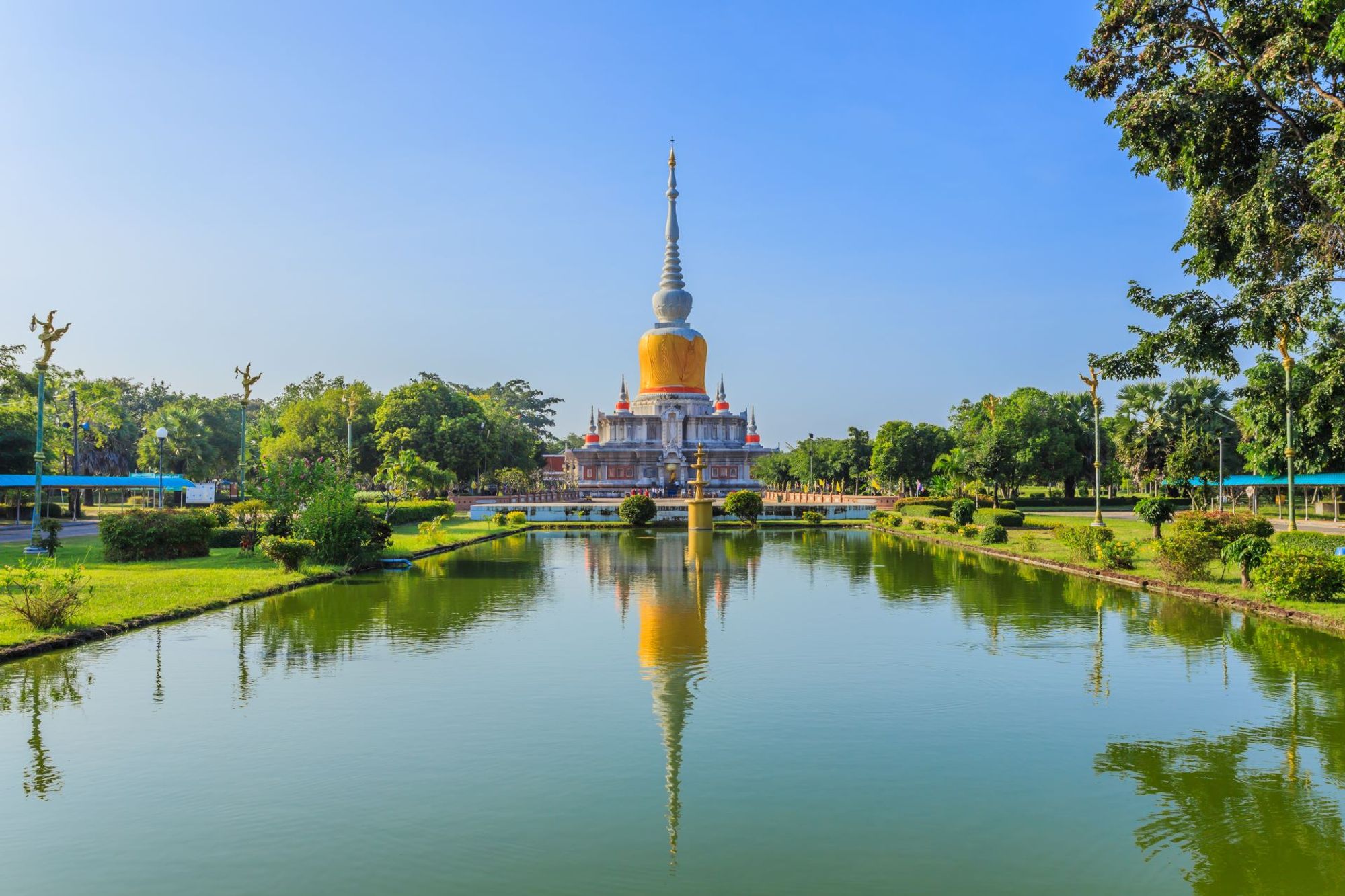 A Thai temple viewed across a lake