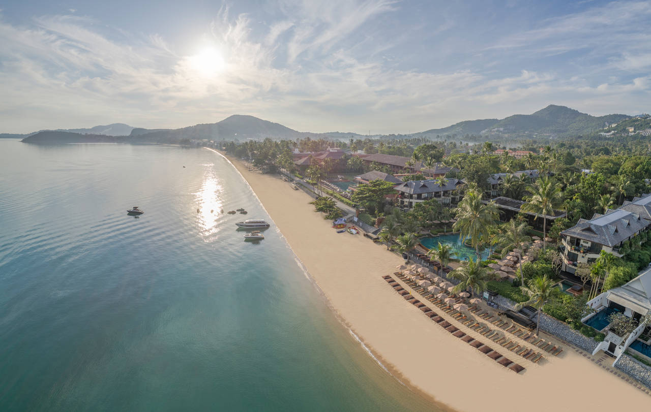 An aerial view of golden sand beach with turqoise waters