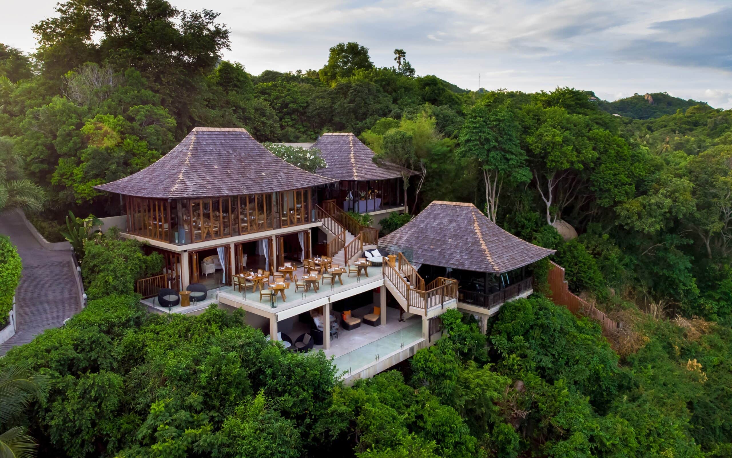 An aerial veiw of a restaurant nestled in lush vegetation